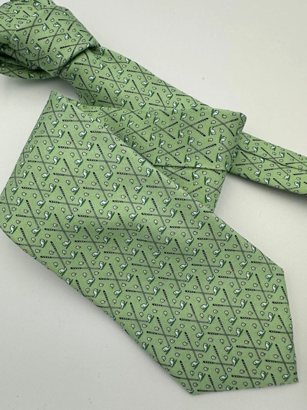 Vineyard Vines men's green silk necktie featuring a repeating golf club and ball